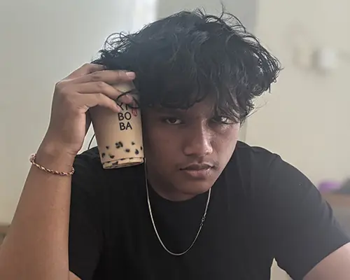 Jaya Anggara holding a cup of boba tea